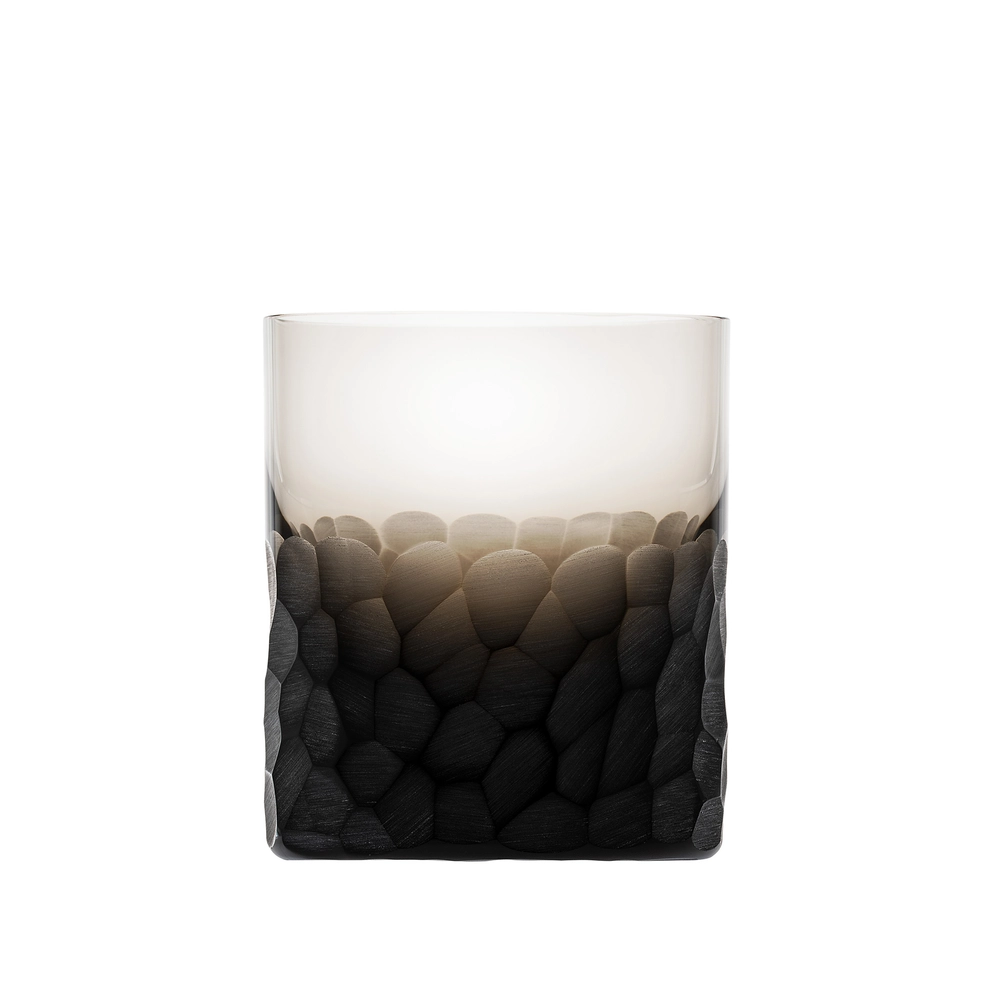 The Moser Pebbles DOF 370 ml is a hand-blown glass tumbler with a textured black stone-like base that fades into a smooth, clear upper section—an eye-catching whisky glass.