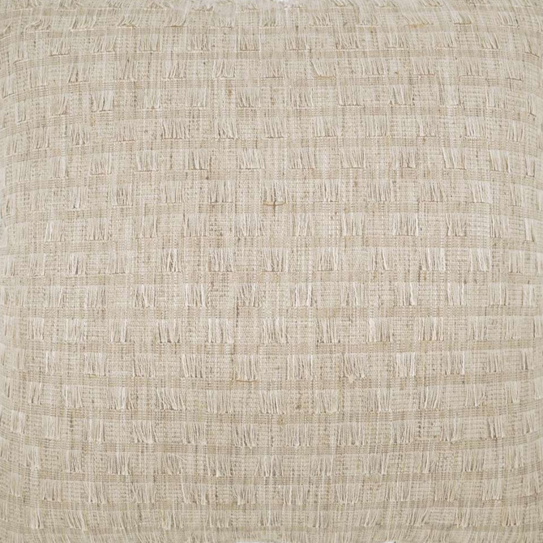 Close-up of the D.V. KAP / Canaan Company Huma Pillow Natural 22 x 22, featuring beige fabric with a subtle textured grid and slightly raised threads for a luxurious look and tactile feel.