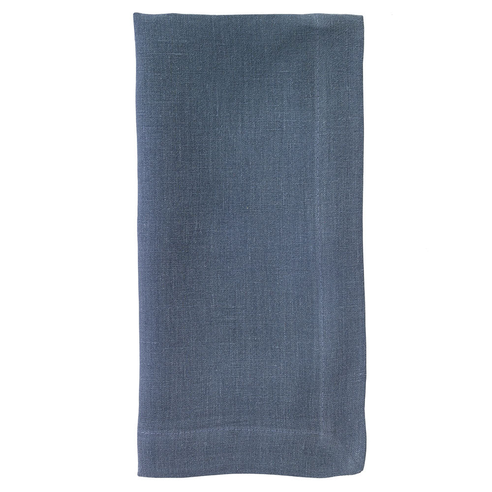 The Bodrum Riviera Napkin Set of 4 features neatly folded, rectangular blue linen napkins with a subtle woven texture, displayed against a plain white background.