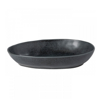 The Livia Dinnerware Matte Black by Casafina/Costa Nova is a shallow, oval, matte-finished stoneware bowl from a modern collection, shown against a white background.