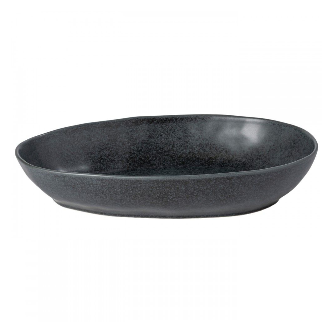 The Livia Dinnerware Matte Black by Casafina/Costa Nova is an oval stoneware dish with a slightly irregular rim, featuring a modern design. Made in Portugal, it’s shown on a white background.