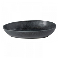 The Livia Dinnerware Matte Black by Casafina/Costa Nova is an oval stoneware dish with a slightly irregular rim, featuring a modern design. Made in Portugal, it’s shown on a white background.