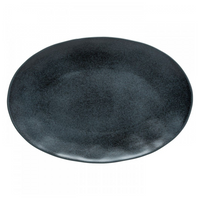 A large, oval, matte black ceramic plate with a slightly uneven rim from the Livia Dinnerware collection by Casafina/Costa Nova, viewed from above on a white background.