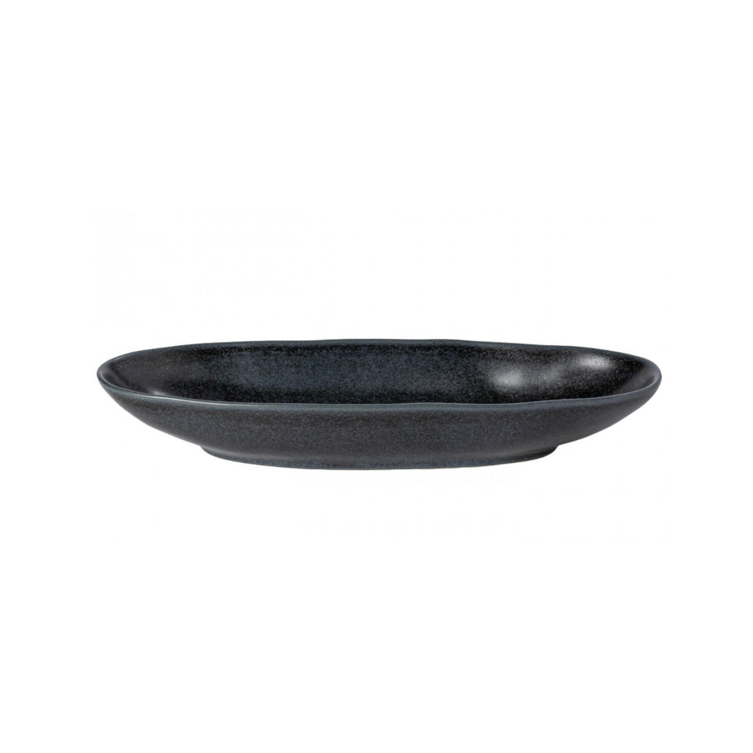 The Livia Dinnerware Matte Black by Casafina/Costa Nova is an oval ceramic plate with a matte finish and gently raised rim, shown against a plain white background as part of a modern tableware collection.