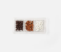 The Blue Pheasant Livingston 3 Section Serving Tray in clear displays chocolate-covered coffee beans, pecan nuts, and white yogurt-covered pretzels, all neatly arranged side by side on a white background.