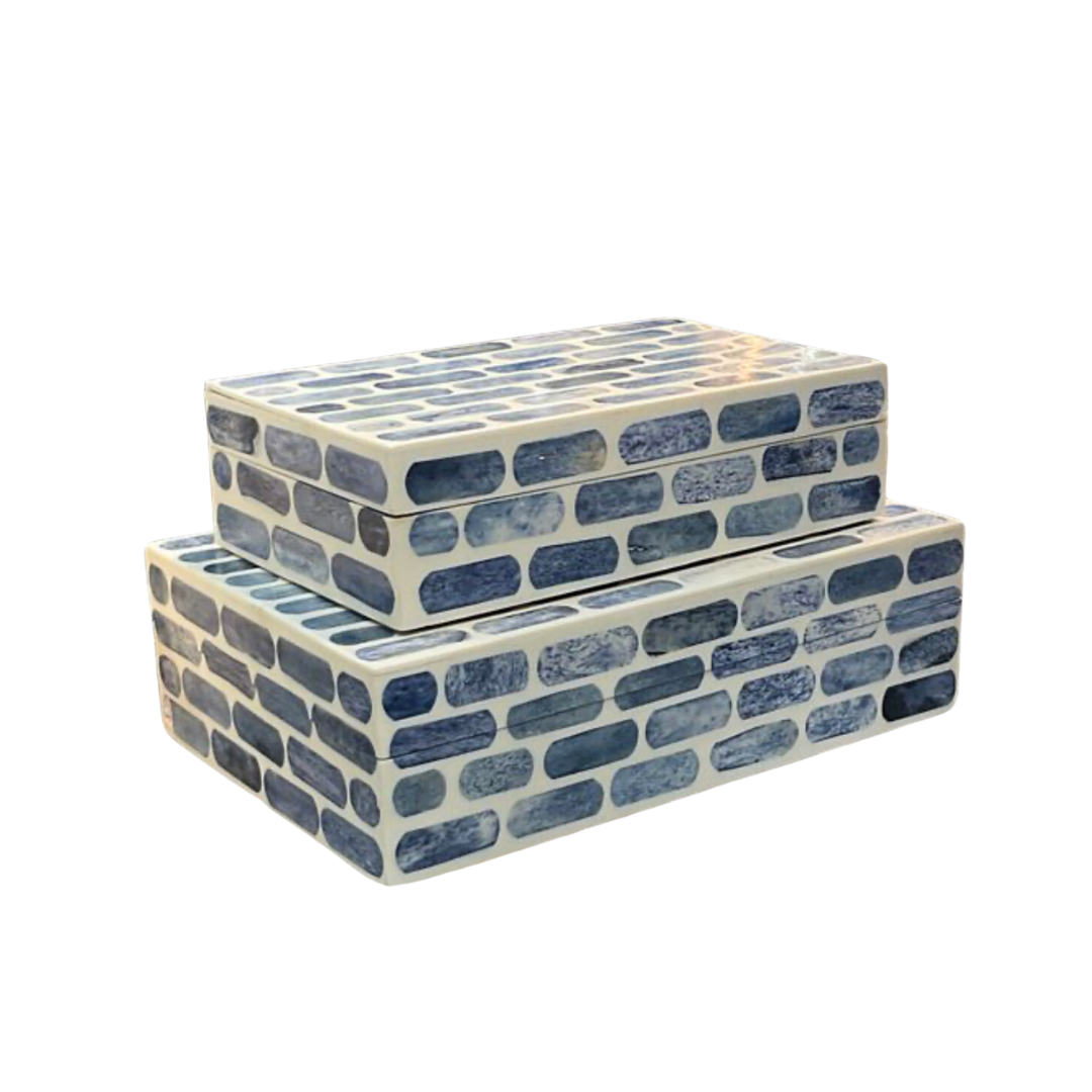 Two Blue Step Bone Boxes by A Sanoma Inc, featuring a blue and white brick pattern, are stacked against a white background. Each box is handcrafted in the Himalayas.