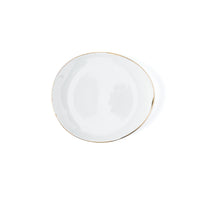 The Molecot Simply Gold Dinnerware plate features plain white Limoges porcelain with a slightly irregular shape and a thin gold rim—an elegant piece for any gold dinnerware collection, shown here on a white background.
