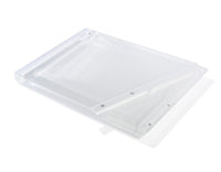 The Apeloig Solid Acrylic Challah Board & Knife features a translucent white rectangular acrylic board with a matching slotted divider, arranged diagonally for a sleek, modern look against a plain white background.