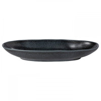 The Casafina/Costa Nova Livia Dinnerware Matte Black plate is a dark, oval ceramic piece with a slightly raised rim, featured as part of a modern tableware collection and shown against a plain white background.