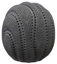 The Solar Sphere - Black by Jamie Young is a round porcelain vase with a textured, sea urchin–inspired surface of small holes and raised bumps, creating a striking decorative piece.