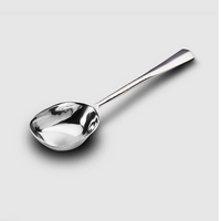 The Mary Jurek Alta Deep Garden Vegetable Spoon, with its hammered handle, rests on a light gray background—an elegant addition to your stainless steel serveware and serving utensils.