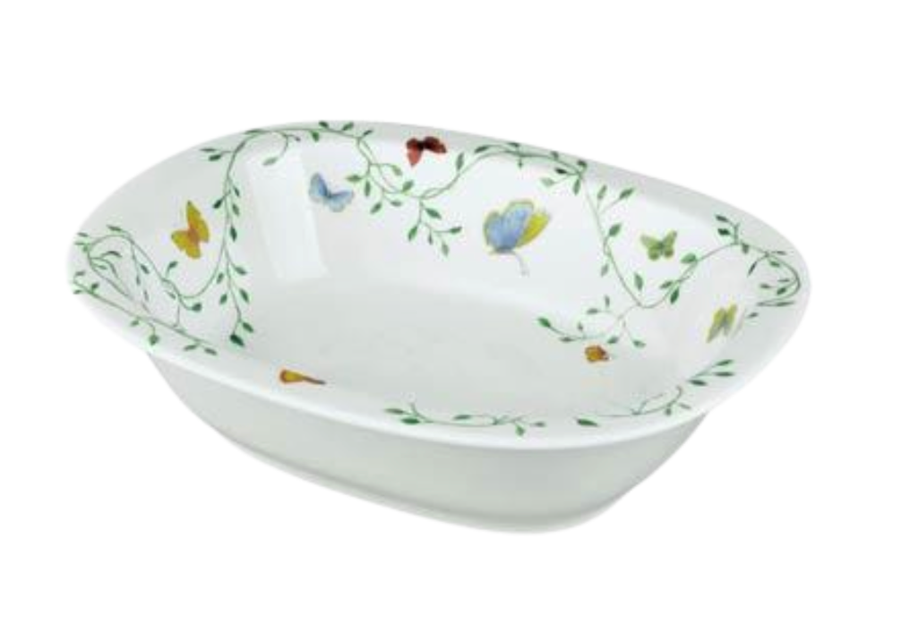The Raynaud Histoire Naturelle Dinnerware is a white rectangular ceramic bowl featuring colorful butterflies, rare birds, and green vines along the inner rim for an elevated dining experience.