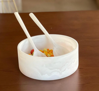 Dawn Resin Swirl Serving Bowl White - Medium containing chopped vegetables and two matching serving spoons.