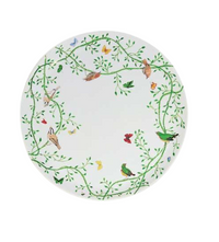 The Histoire Naturelle Dinnerware by Raynaud features a white plate with green vines, leaves, rare birds, and butterflies—bringing French excellence to your table.
