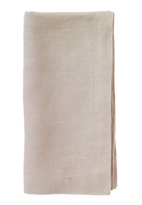 The Bodrum Riviera Napkin Set of 4 features neatly folded, light beige stone-washed linen napkins with visible edge stitching, displayed on a white background for an elegant everyday touch.