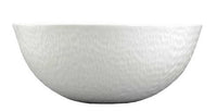 The Raynaud Mineral Dinnerware Glazed White bowl features a plain, round design with a smooth, subtly textured white ceramic surface inspired by classic French dinnerware, displayed against a white background.