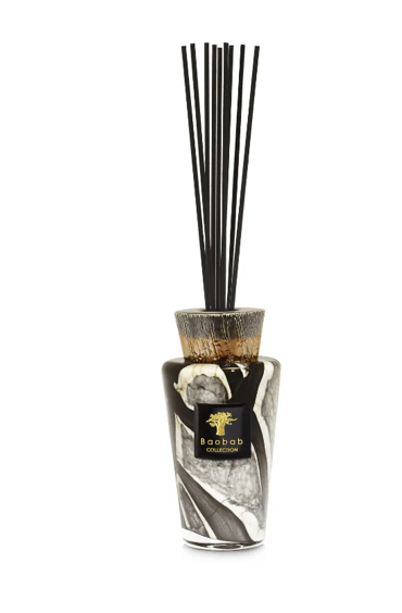 The Baobab Stones Diffuser - Marble features hand-blown glass with a marbled black, white, and gray design, accented with gold and black reed sticks—a collector's piece from the Totem Marble range.