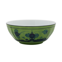 The Oriente Italiano Dinnerware Malachite by Ginori 1735 is a green ceramic bowl featuring dark blue floral and decorative patterns around the exterior, showcased on a plain white background.