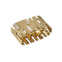 Sure! Here is the rewritten sentence using the provided product data: This Matrix Napkin Ring Set of 4 in Gold by Kim Seybert features a bold, wide silhouette with a textured, vertical bar pattern and rectangular inlaid opal accents on the top, echoing the sophisticated charm of a statement gold ring.
