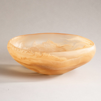 The Mayan Resin Bowl by CDMX / MONICA CALDERON is a handmade, shallow round bowl from Mexico with warm beige and caramel waves in translucent resin—perfect as a serving piece. Photographed on a plain light background.
