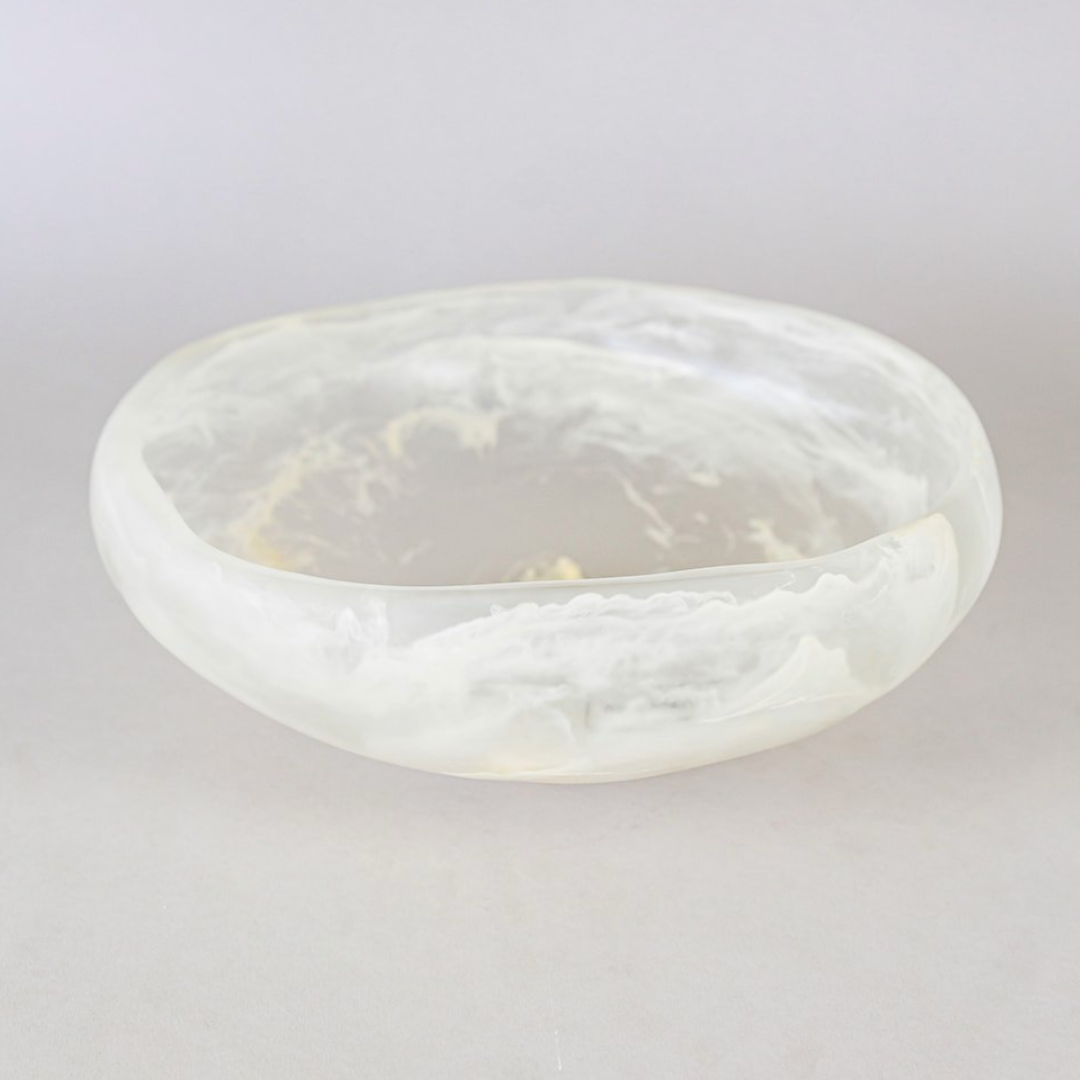 Handmade in Mexico, the Mayan Resin Bowl by CDMX / MONICA CALDERON features a translucent white finish with a cloudy, marble-like pattern and smooth, irregular edges—a unique serving piece that brings elegance to any table.