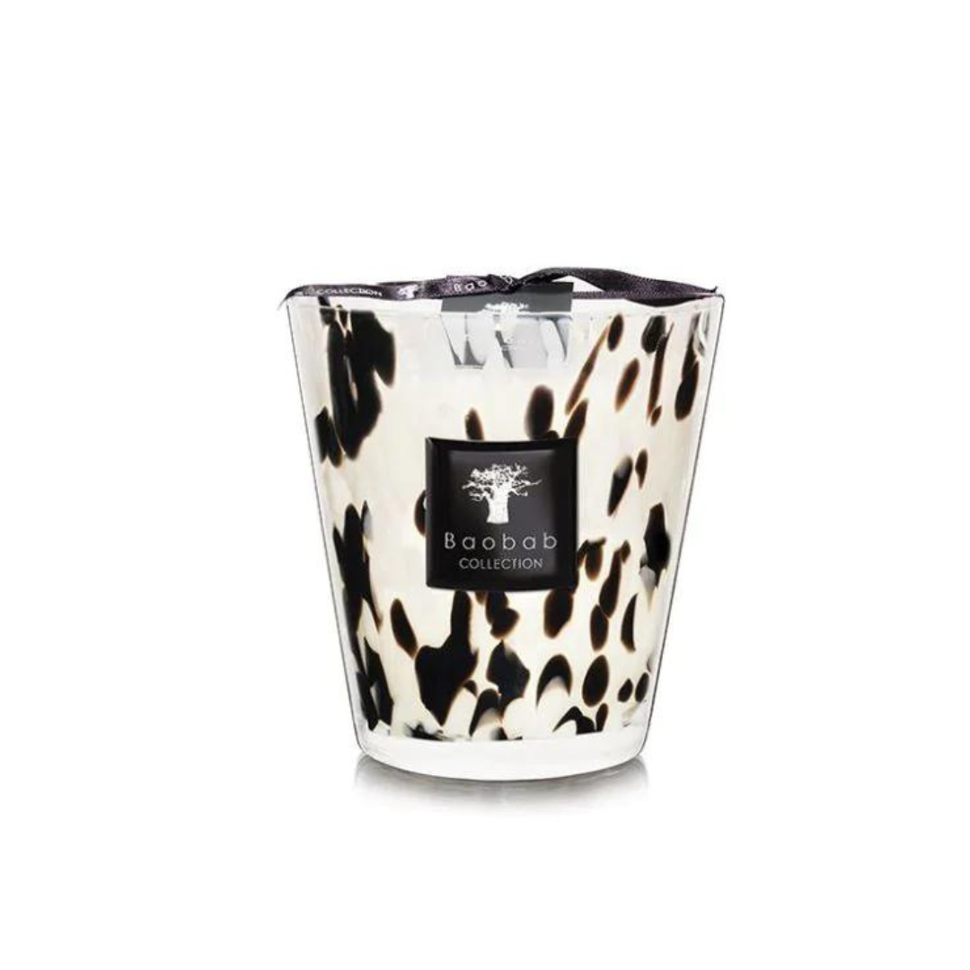 A Baobab Pearls Candle in a hand-blown spotted glass holder with a black brand label, unused and protected, features a ginger and black rose scent.