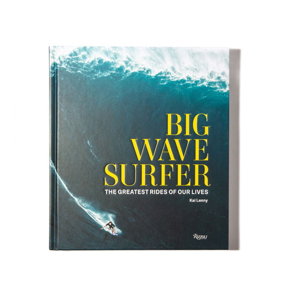 The book "Big Wave Surfer" by Rizzoli features a surfer riding a huge wave, bold yellow title text, and dramatic surfing photography that captures the excitement of big wave surfing.