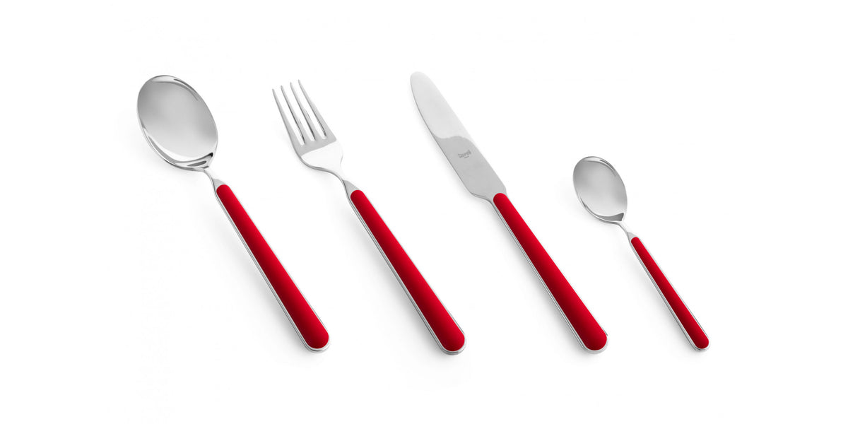 The Mepra Fantasia Flatware 5 Piece Set (available in 16 colors) features shiny metal heads and vibrant handles, displayed in a row on a white background.