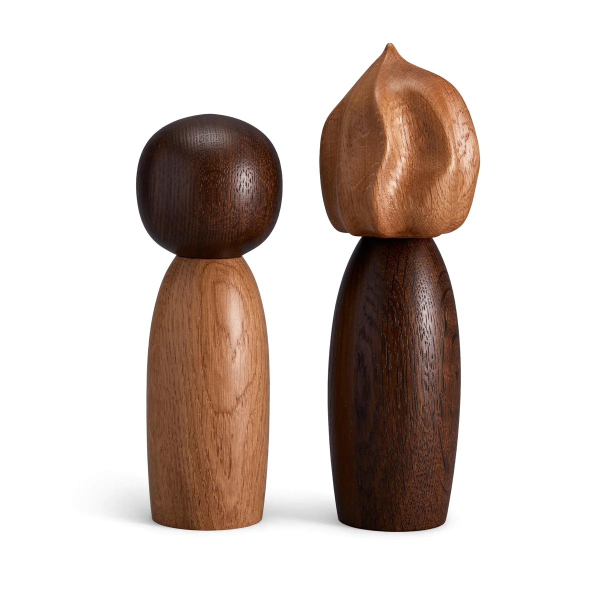 The Picanto Salt + Pepper Mills (Set of 2) by L’Objet feature minimalist oak designs—one with a smooth, round head and the other with a textured, angular head—resembling modern sculptures while serving as stylish table essentials.