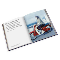 An open book, Travel Series - Mykonos Muse by Assouline, displays a quote on the left and a color photo on the right of a woman in a scarf riding a red and white vintage scooter along a seaside road, evoking Greek island adventures.