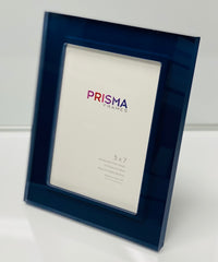 The Prisma Frame - Midnight by Bella Moulding is a blue, translucent acrylic frame for 5x7 photos. Crafted from archival materials, it stands upright with a branded placeholder card, shown against a white background.