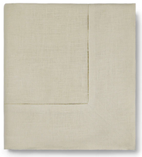 The Sferra Festival Tablecloth in light beige features a subtle hemstitch border and is elegantly displayed on a plain background.
