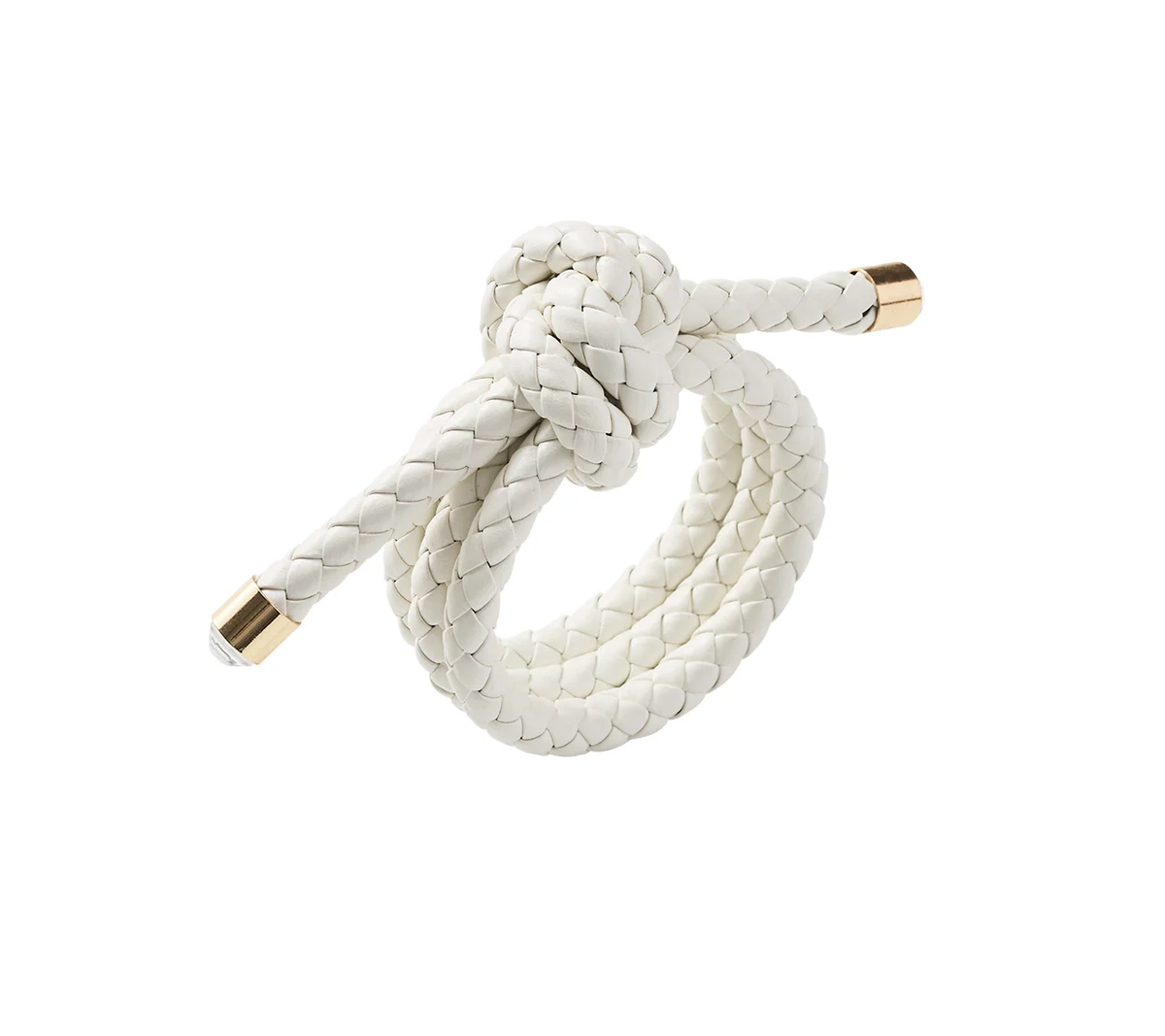 A Rope Knot Napkin Ring Set of 4 by Kim Seybert, featuring white faux leather braids knotted and finished with gold metal caps, is shown on a white background for a subtle coastal design accent.