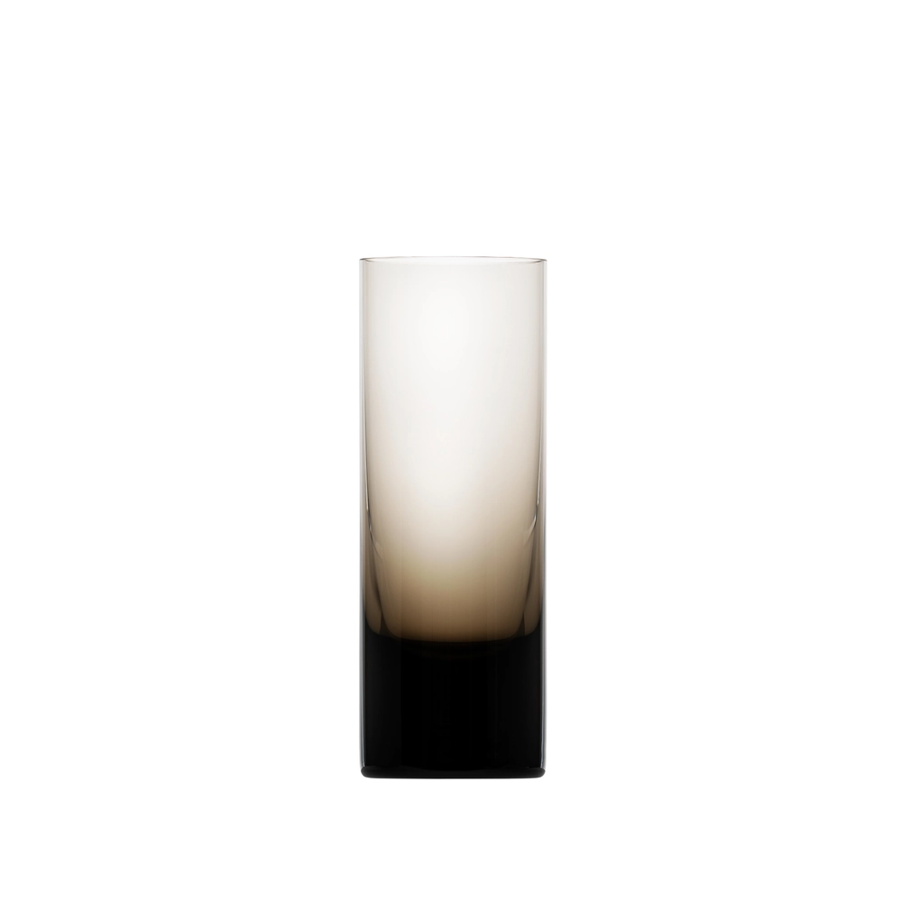 The Moser Whiskey Spirit Glass is a tall, cylindrical glass featuring a gradient design that fades from dark at the base to clear at the top, set against a white background.