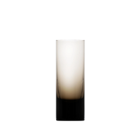 The Moser Whiskey Spirit Glass is a tall, cylindrical glass featuring a gradient design that fades from dark at the base to clear at the top, set against a white background.