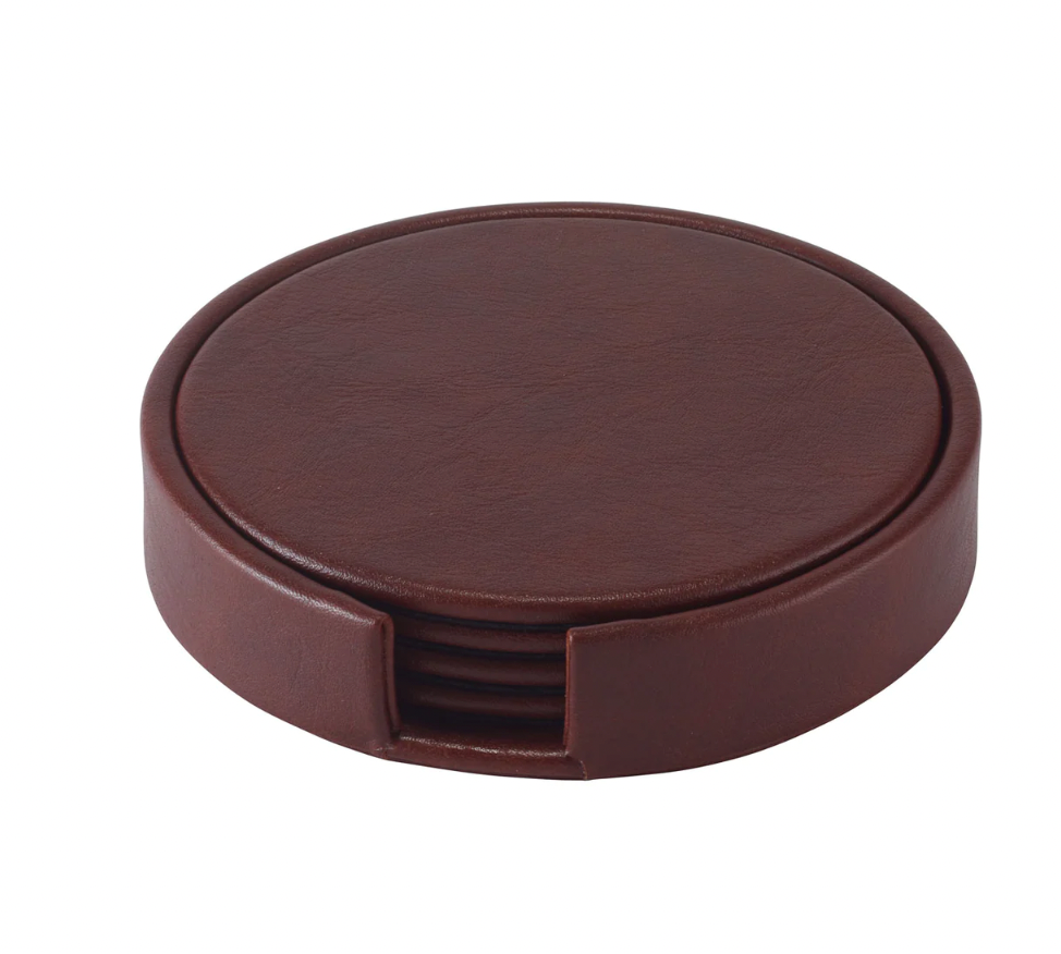 The Bodrum Tanner Coaster Set & Holder features a round brown leather holder with an open front slot, neatly stacking elegant coasters for easy access and protection of your furniture.