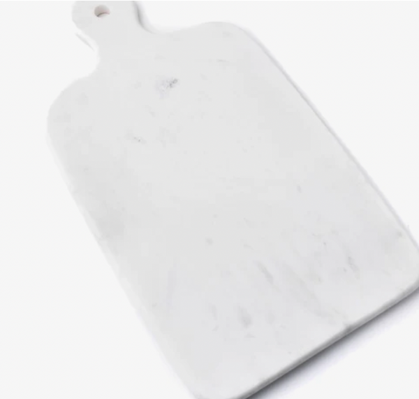 The Simon Pearce Marble Large Board is a rectangular white natural marble serving board with a handle and a small hanging hole, shown on a white background.