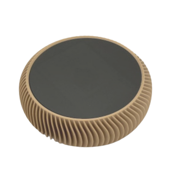 The La Redonda Round 3D Single Card Deck Holder by Luxe Dominoes features a black center and textured tan ridged edge. Its round, flat design is displayed against a white background.
