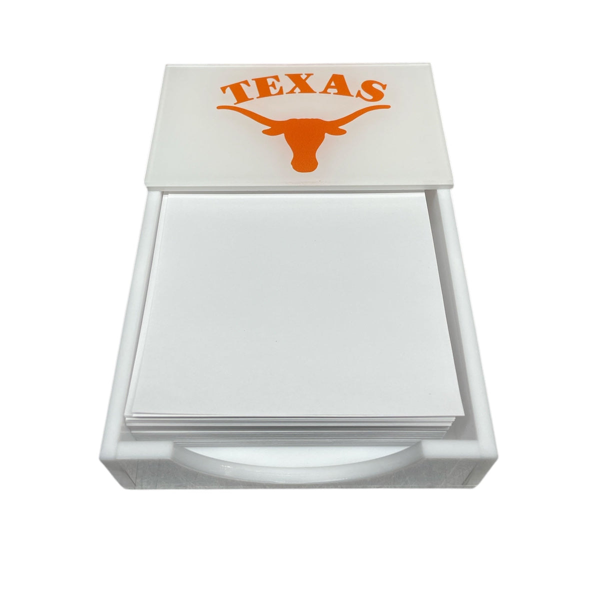 The Eye Candy College Note Pad is a white holder with blank paper, featuring an orange Texas Longhorn logo and "TEXAS" on the lid—an ideal graduation gift.