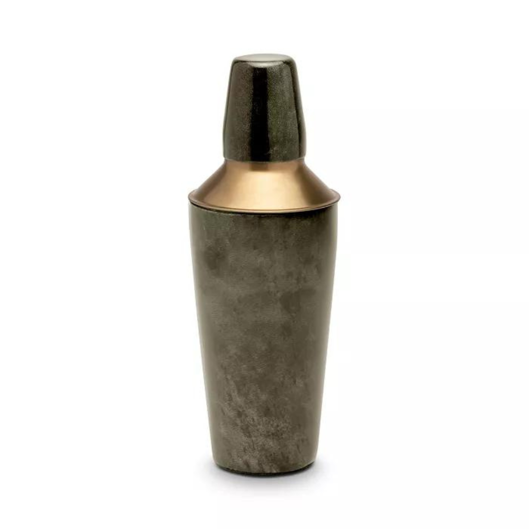 The Nelson Grey Vellum Cocktail Shaker by Blue Pheasant is a metallic shaker with a dark brushed body and gold-toned cap and collar, shown standing upright on a white background—an ideal addition to any home bar.