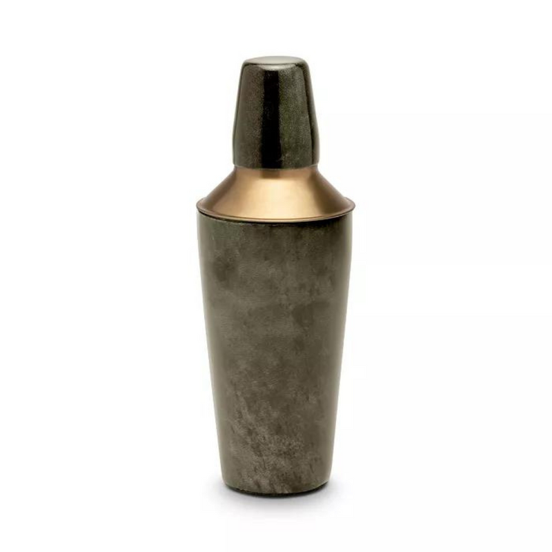 The Nelson Grey Vellum Cocktail Shaker by Blue Pheasant is a metallic shaker with a dark brushed body and gold-toned cap and collar, shown standing upright on a white background—an ideal addition to any home bar.