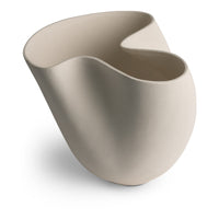 The FlowDecor Inc. Carmen Vase is a white vase with an abstract, asymmetrical silhouette and smooth curves, shown on a white background.