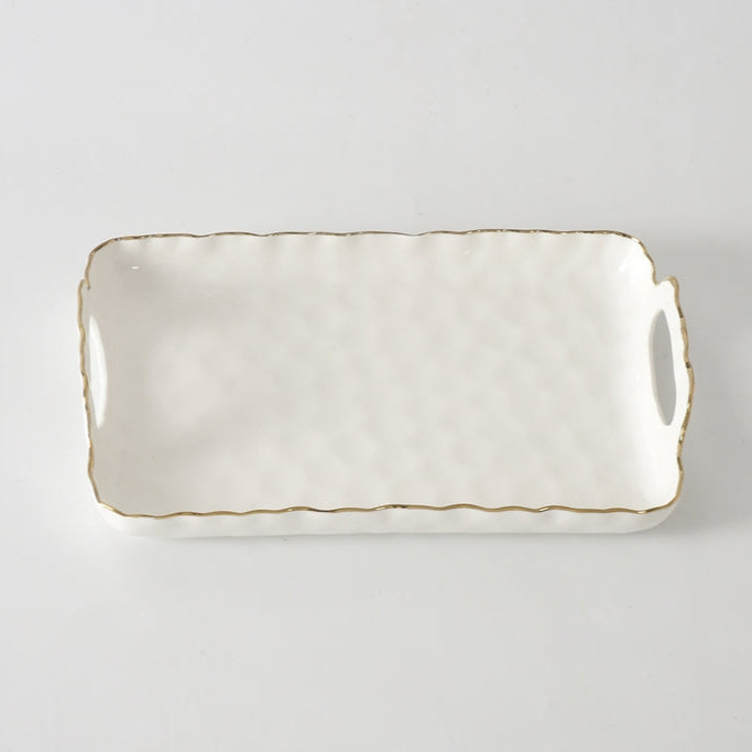 The PAMPA BAY Portofino Handle Tray 12.5" is a rectangular white porcelain platter with textured surface, gold-trimmed wavy edges, and two side handles, shown on a plain light background.