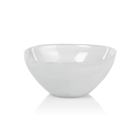 The Zodax Monte Carlo White Alabaster Bowl features a smooth, round ceramic design in plain white—a subtle, elegant piece ideal for enhancing any table setting.