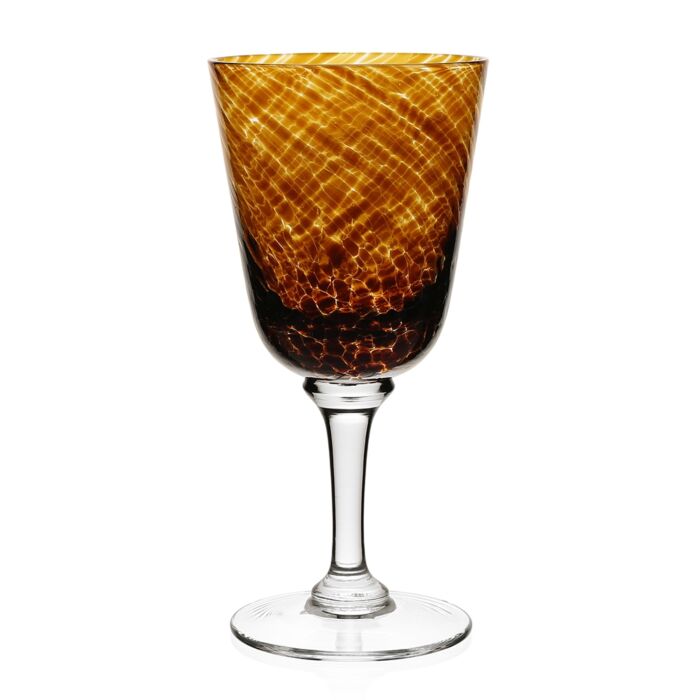 The Vanessa Drinkware Tortoise by William Yeoward is a wine glass with a clear stem and base, featuring a bowl with an amber and brown marbled pattern for a luxurious, textured look.