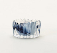 The Splash Catchall Bowl by Gary Bodker is a small, clear handcrafted glass dish with wavy textured sides and a blue swirl pattern in the center, shown against a plain white background.