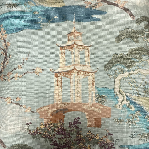 The Zen Pillow Seaspray 22 x 22 by Decor Fifty-Five features an Asian-inspired design with an embroidered pagoda, blooming trees, water, and landscape in blue, green, and beige linen.