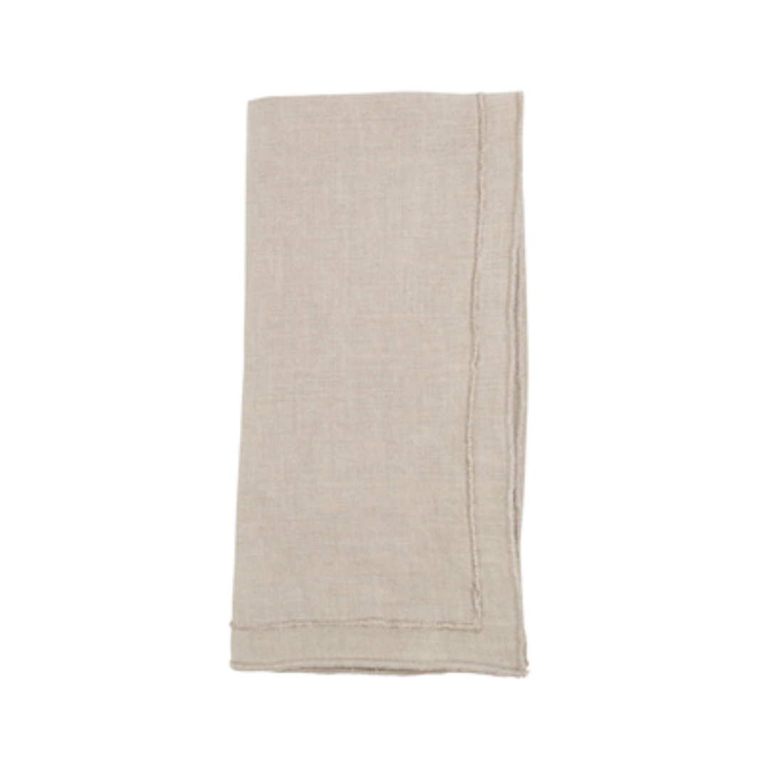The Saro Trading Overlock Stonewash Border Napkin in beige, with visible stitched edges, adds a refined touch to your summer table collection—displayed neatly folded against a white background.