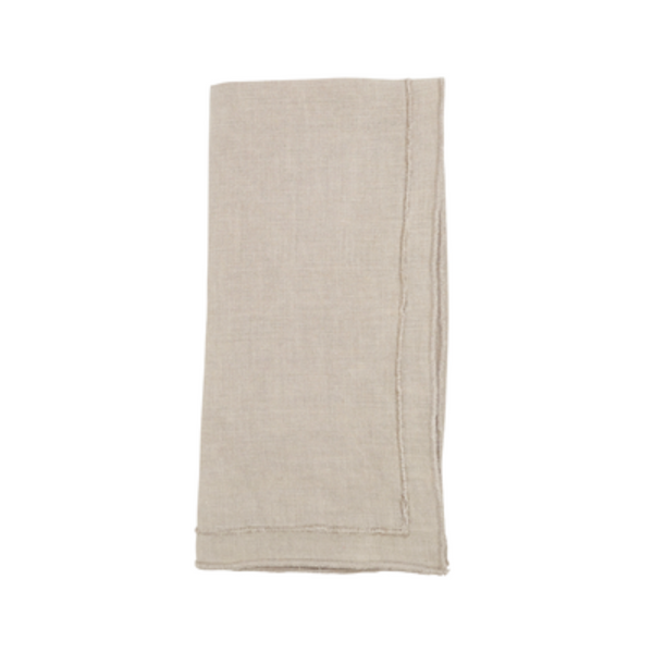 The Saro Trading Overlock Stonewash Border Napkin in beige, with visible stitched edges, adds a refined touch to your summer table collection—displayed neatly folded against a white background.