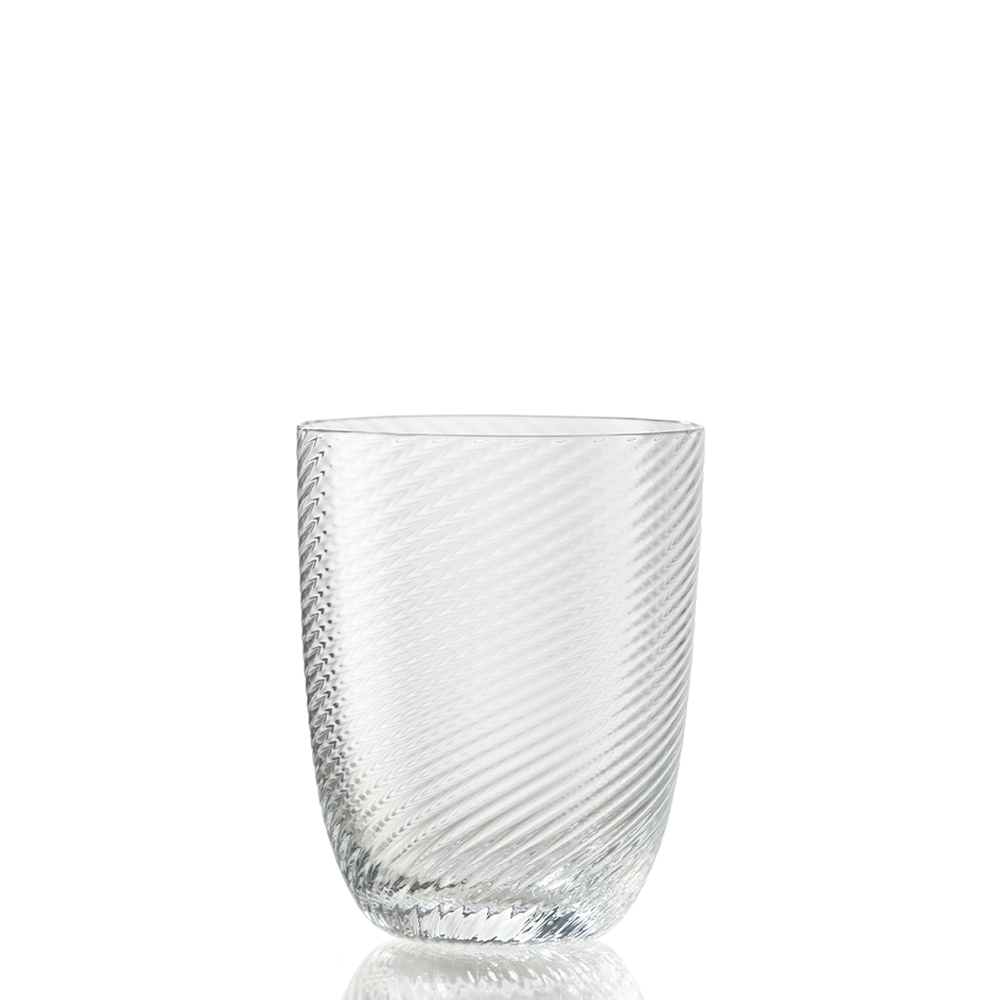 The Idra Tumbler Torse by Nason Moretti is a clear glass tumbler featuring a subtle diagonal textured pattern, presented against a plain white background.